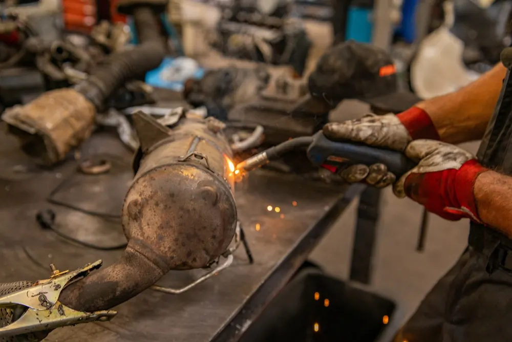 Diesel particulate filter housing being welded back together after a full clean